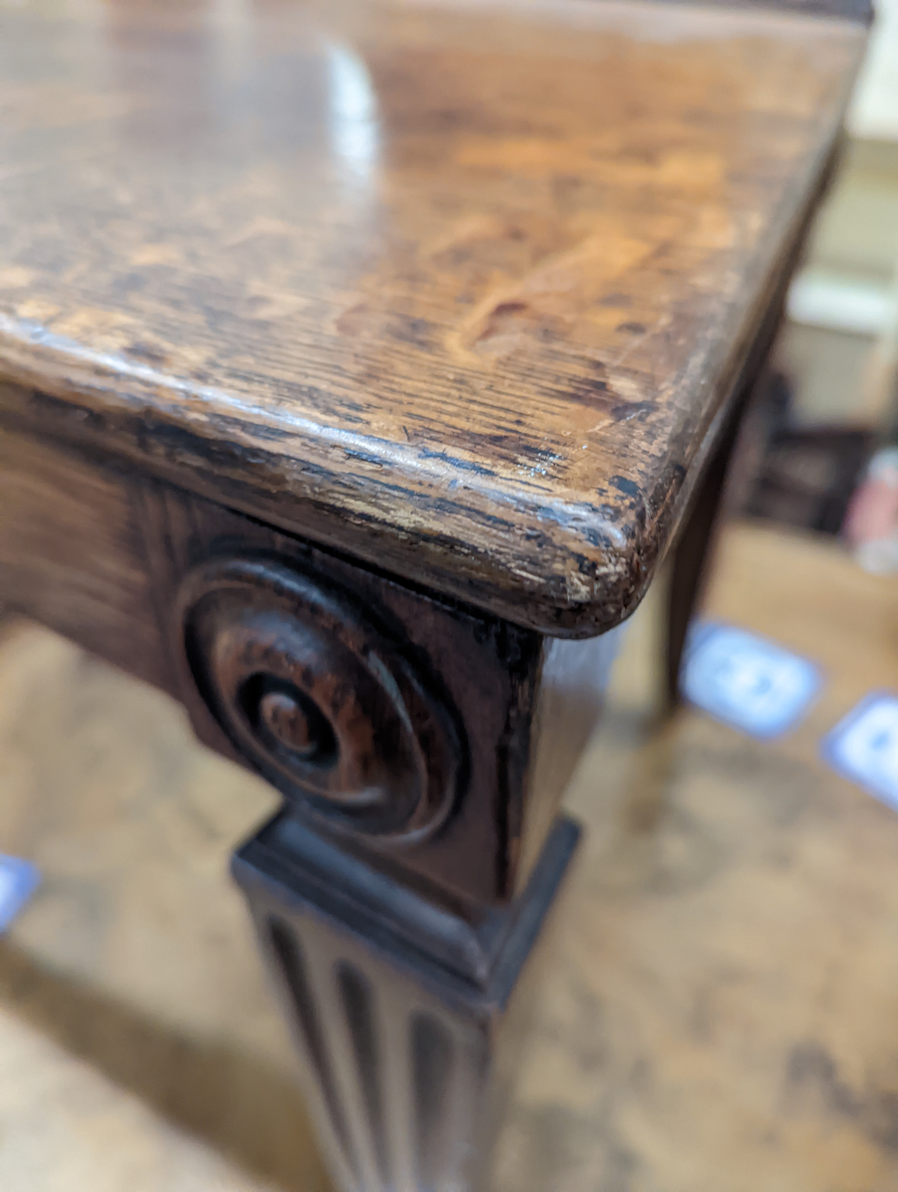 A pair of Victorian oak hall chairs with painted armorials, width 43cm, depth 39cm, height 94cm